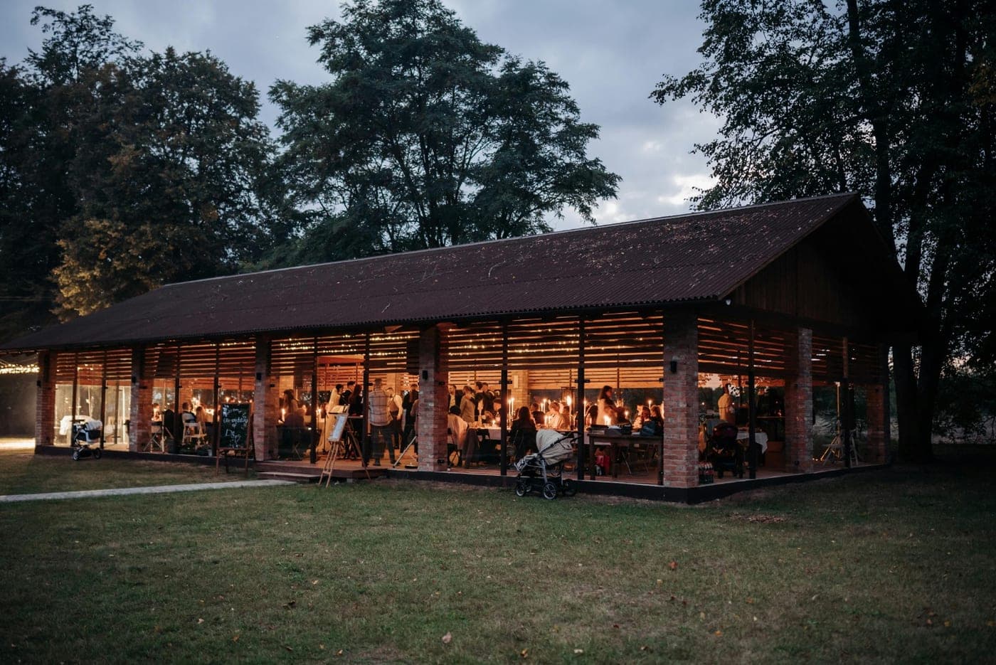 The reception pavilion glowing at dusk